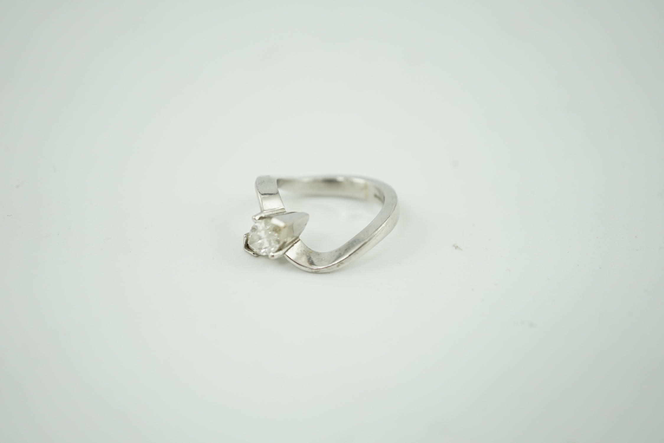 A modern 18ct white gold and solitaire marquise cut diamond set ring